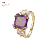 Solitaire big emeald cut colorful CZ sided with two white CZs 14K Gold engagement rings