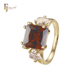 Solitaire big emeald cut colorful CZ sided with two white CZs 14K Gold engagement rings