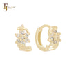 Twisted vortex of cluster white CZs 14K Gold Huggie Earrings