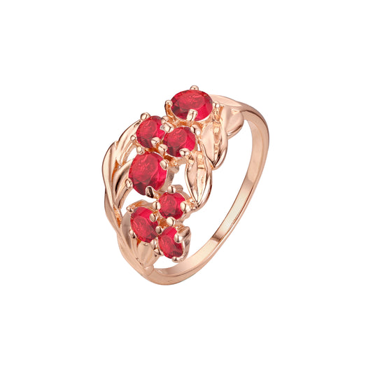 Anillos de hojas y piedras rojas en racimo de lujo de oro rosa