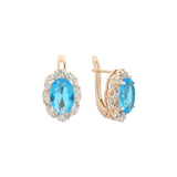 Rose Gold two tone earrings with Lake Blue stone