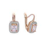 Aretes de oro rosa con halo de piedra talla esmeralda